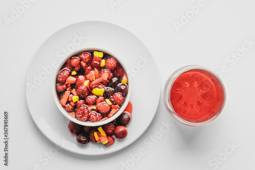 Fruit salad and juice on white background. Healthy breakfast concept.