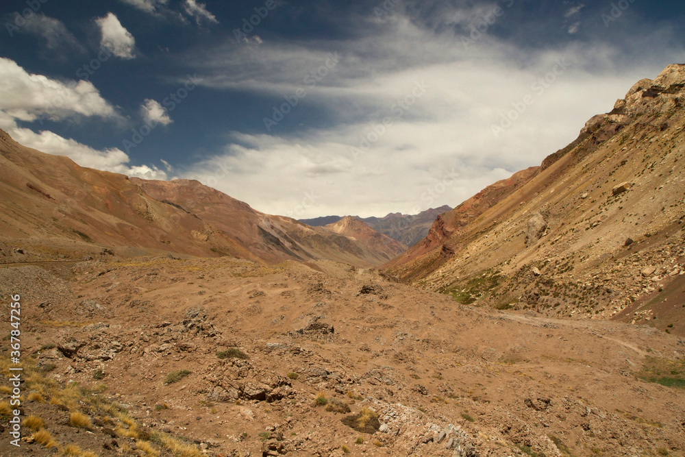 Geology. Panorama view of the golden meadow, valley and rocky mountains.	
