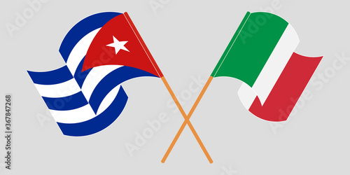 Crossed and waving flags of Cuba and Italy