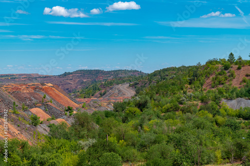 Ukraine, Krivoy Rog, unique place called "Ukrainian Mars". Waste rocks create multicolored mosaic. Open mine site with rare earth materials.