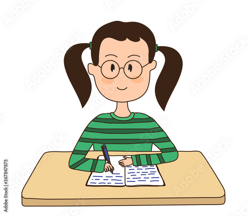 The girl sits at the table and writes in a notebook. 