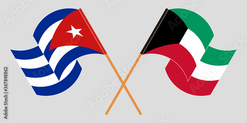 Crossed and waving flags of Cuba and Kuwait
