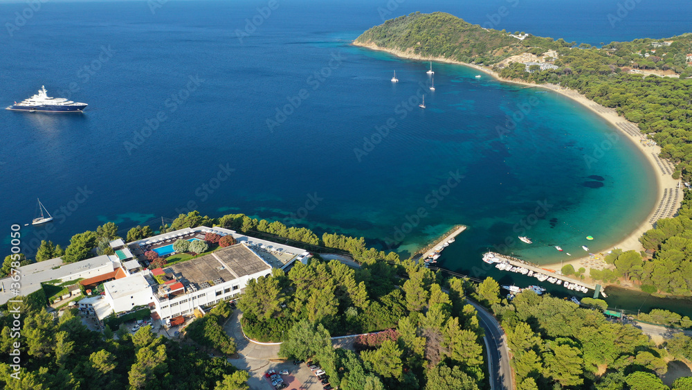 Fototapeta premium Aerial drone photo of beautiful popular organised sandy bay, turquoise beach and natural preserve lake with pine trees of Koukounaries, Skiathos island, Sporades, Greece