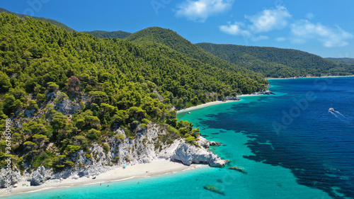 Aerial drone panoramic photo of famous turquoise paradise beach of Hovolo covered with pine trees, Skopelos island, Sporades, Greece photo