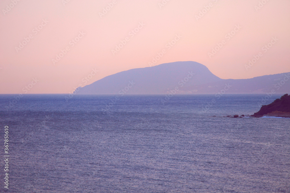 Seascape in Crimea with a view of the Bear Mountain after sunset