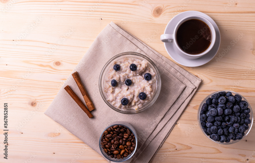 blueberries and porridge as morning healthy breakfast concept blueberries and porridge as morning healthy breakfast concept
