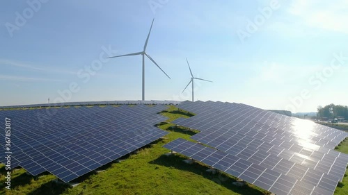 SLO MO AERIAL WS Solar panels and wind turbines in field / Geldermalsen, Gelderland, Netherlands photo