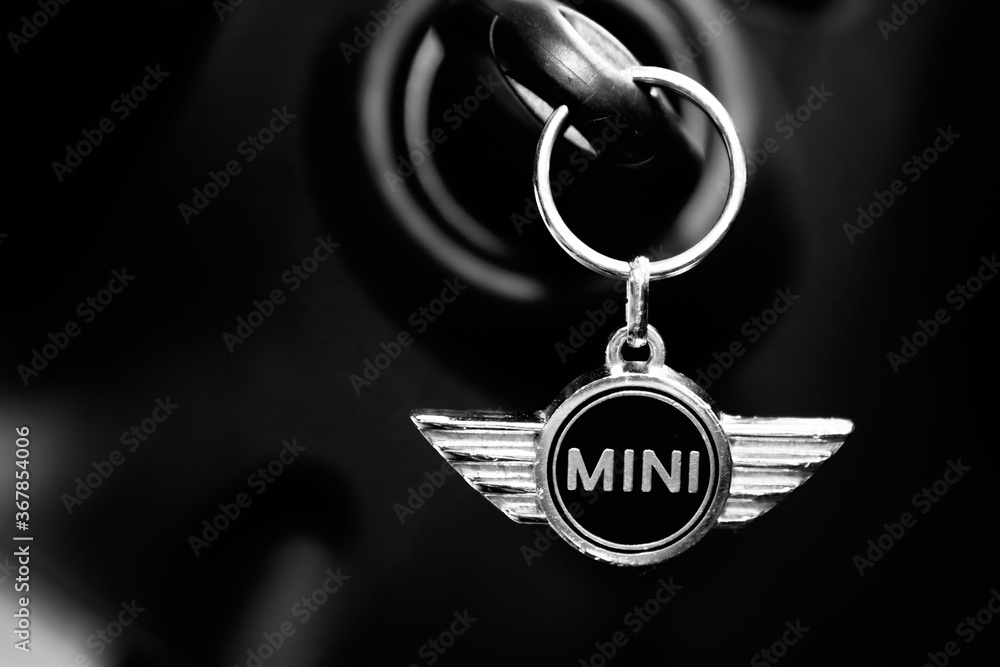MINI car logo wings and text sign on silver keychain in black interior  Stock-Foto | Adobe Stock
