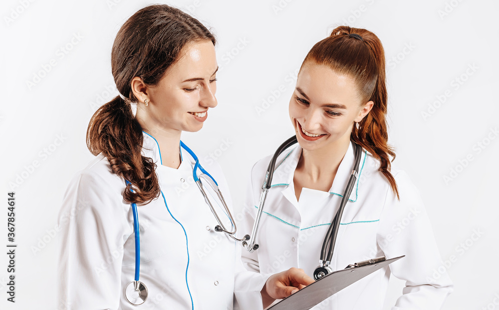 Medical documents. Two doctors with stethoscope at hospital. Nurse hold patient medical chart. Information data. Therapist in uniform. Medical history prescription. Woman work at clinic. Medical documents. Two doctors with stethoscope at hospital. Nurse hold patient medical chart. Information data. Therapist in uniform. Medical history prescription. Woman work at clinic.