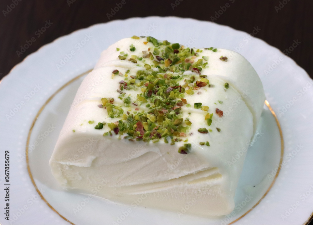 Milk ice cream. Handmade ice cream with pistachio nuts. Maras ice cream. (Maras Dondurmasi)