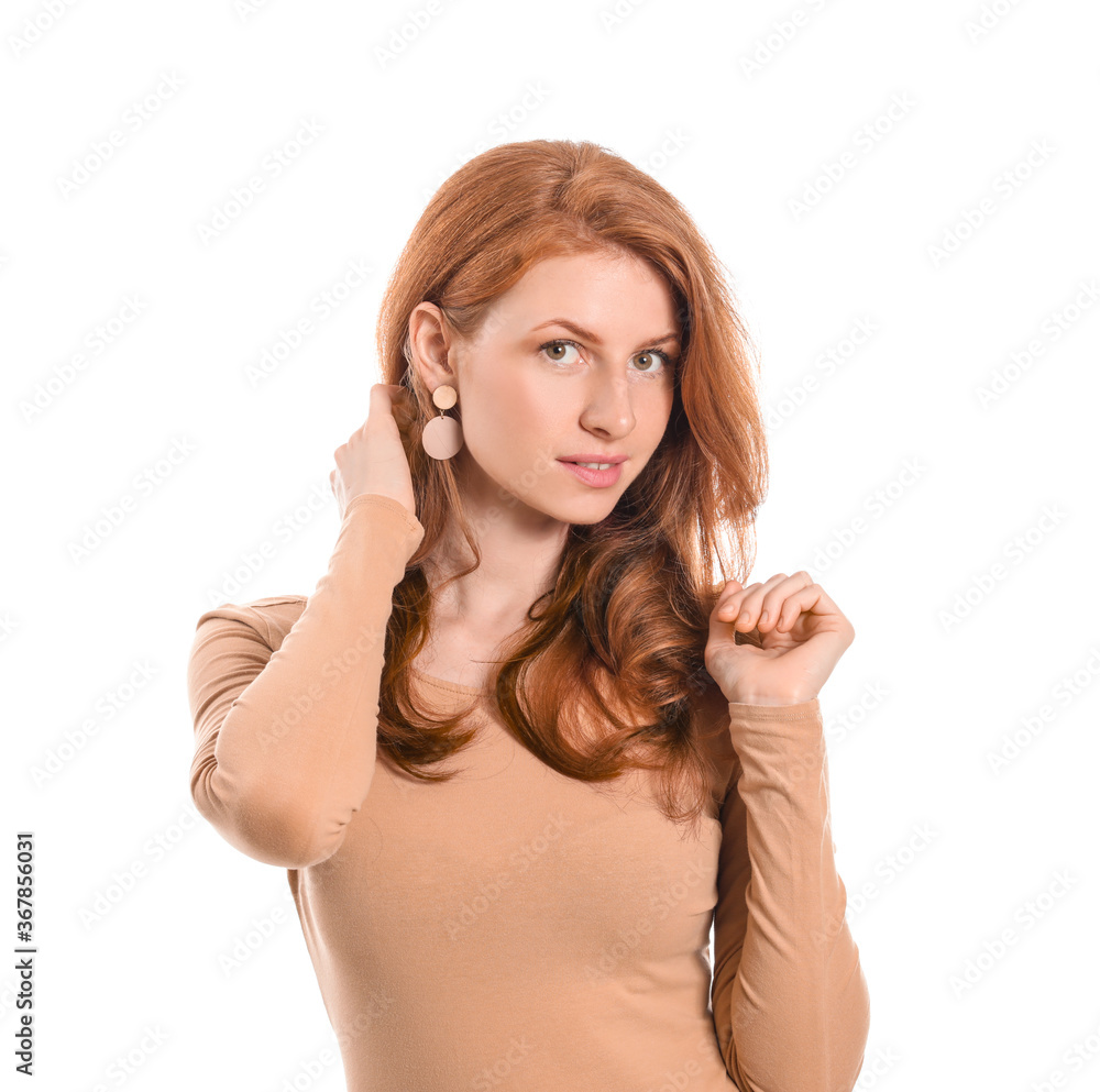 Beautiful young redhead woman on white background