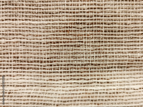 Wicker textile weave threads texture background with selective focus