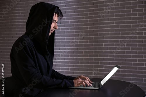 Professional hacker using l...
