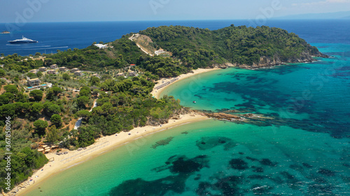 Aerial drone photo of paradise beaches of Banana and small Banana covered with pine trees in beautiful island of Skiathos  Sporades  Greece