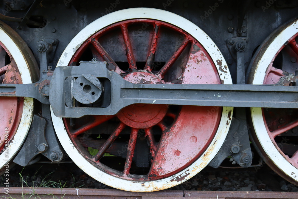 Steel red wheels of an old locomotive 