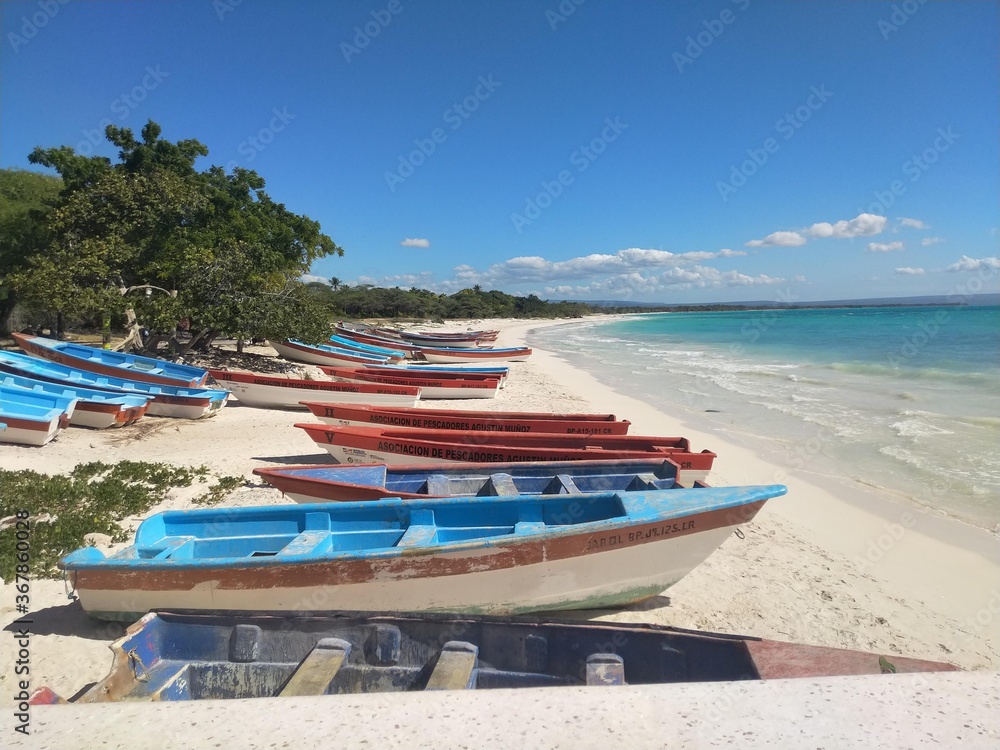 Fototapeta Quiet beach in south, DOminican Republic, fishing boats