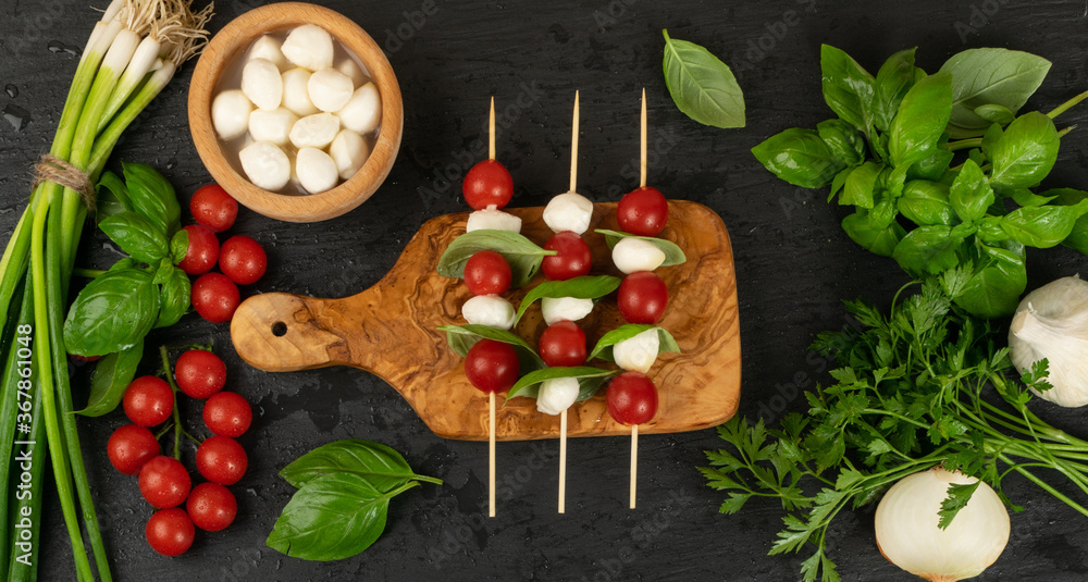 Mozzarella Cheese Balls and Cherry Tomatoes on Skewers Mozzarella Cheese Balls and Cherry Tomatoes on Skewers