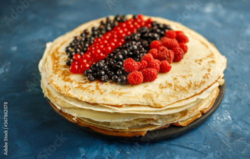Pancakes. Stack of pancakes topped with berry jam. Breakfast.