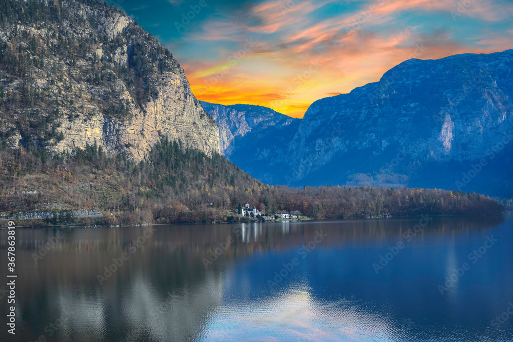 Lake hallstatt twilight with mountain and castle in Austrian Alps