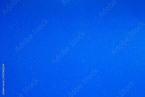 abstract water drops on a modern bue plastic as background