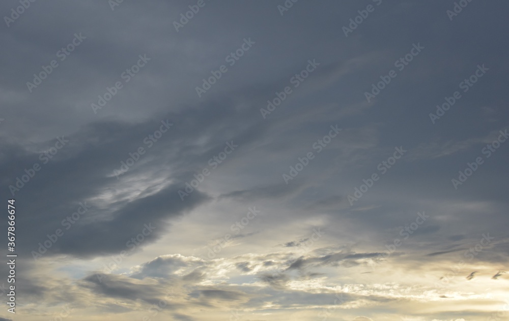 Dark storm and rainy clouds. Abstract storm and rainy clouds. The sun shines through the gloomy clouds. Dark storm and rainy clouds. Abstract storm and rainy clouds. The sun shines through the gloomy clouds.