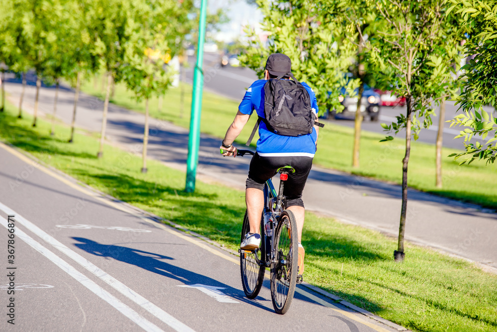 Cyclist ride on the bike path in the city Park
Cyclist ride on the bike path in the city Park