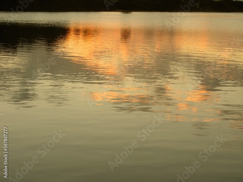 Reflections of a sunset on some water.