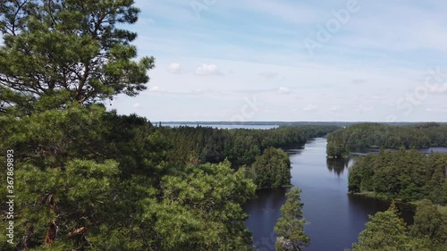 View from Kaukolanharju ridge, Tammela, Finland. Scenic landscape with lakes on beautiful summer day. View from scenic tower in folk park of Saari. photo