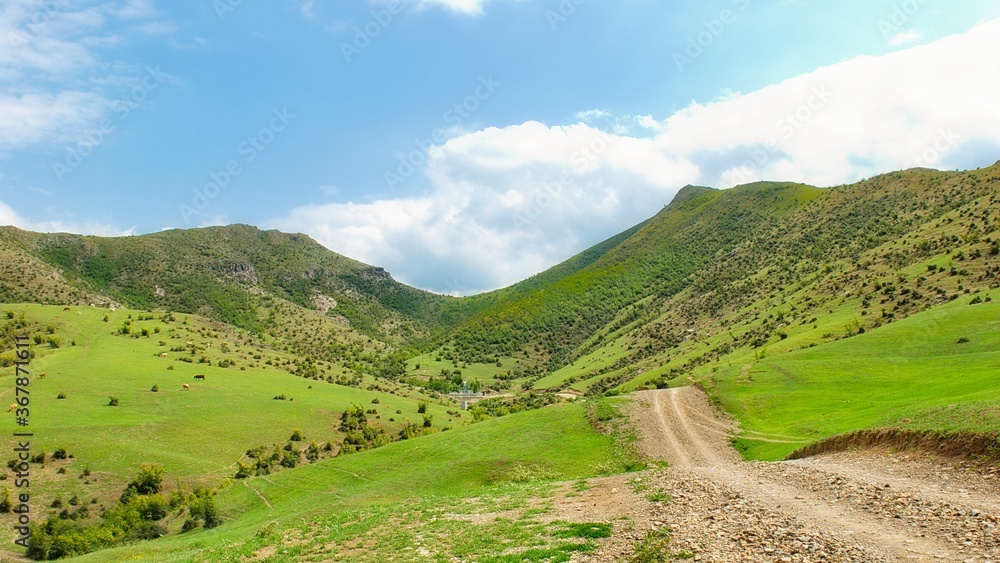 Panorama landscape with green fields under clouds. Tovuz, Azerbaijan
