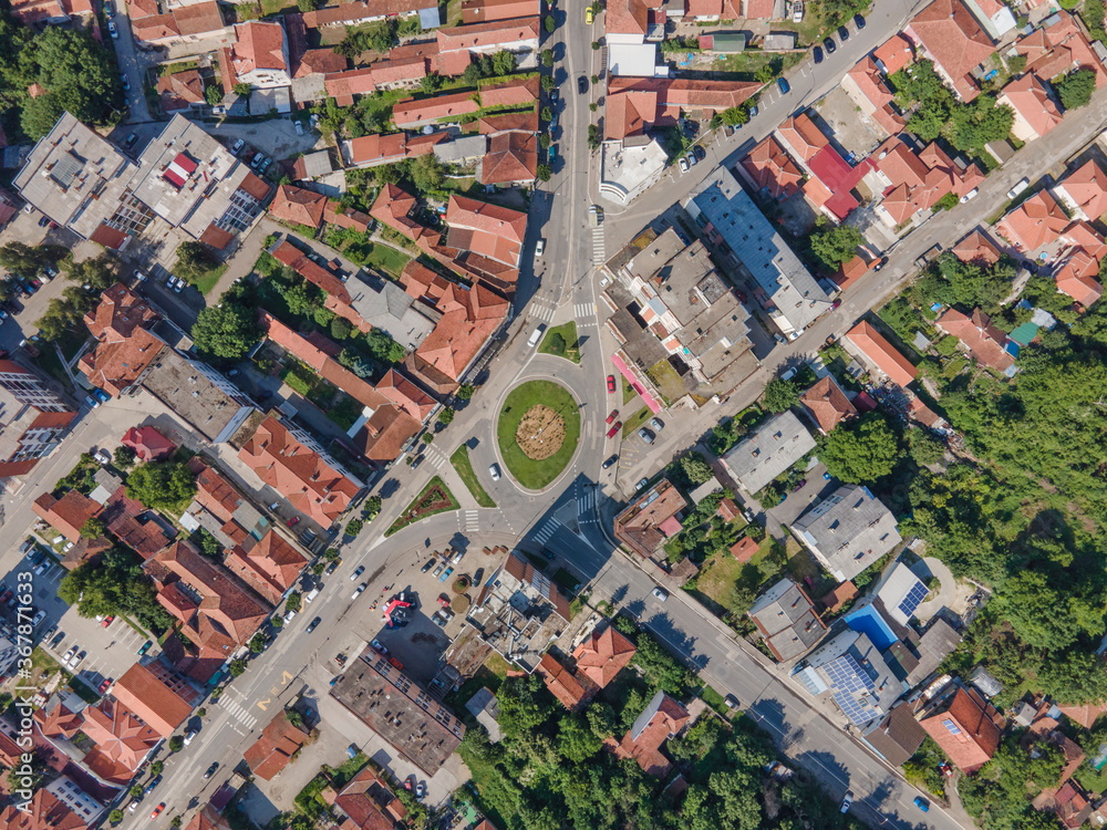 Top down aerial drone view on the main road in Knjazevac town in eastern Serbia with buildings and houses around in sunny summer day