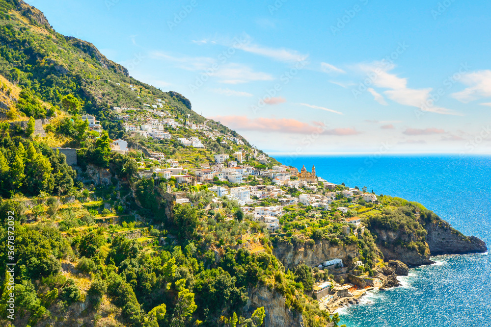 A view of a hilltop town Praiano from a scenic drive along the Amalfi Coast on the Italian Mediterranean