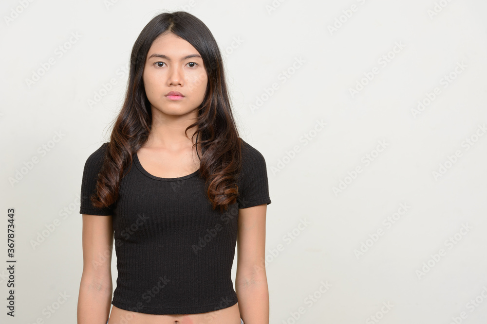 Portrait of young beautiful Asian woman looking at camera Portrait of young beautiful Asian woman looking at camera
