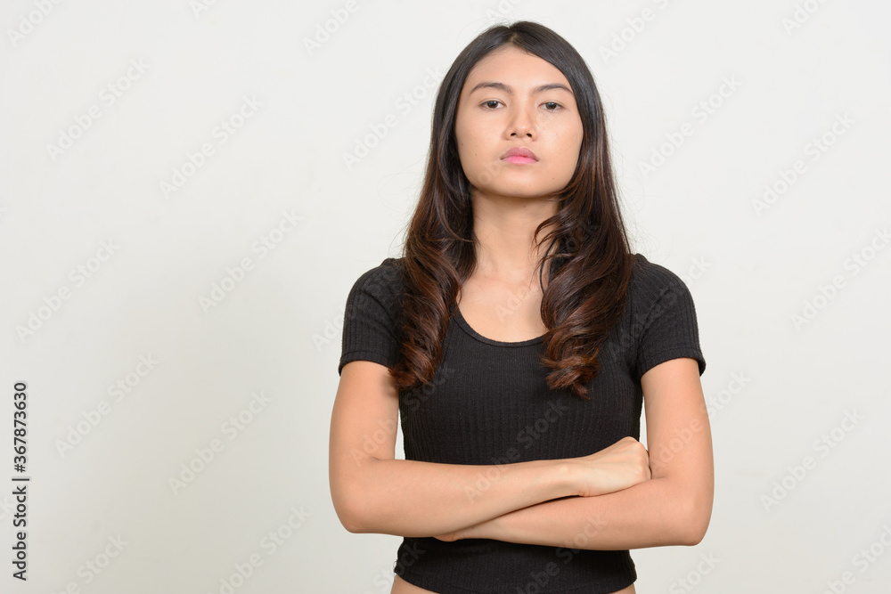 Portrait of young beautiful Asian woman looking at camera Portrait of young beautiful Asian woman looking at camera