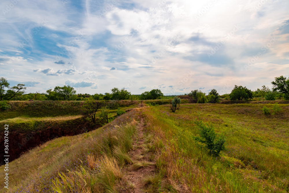 Fototapeta premium Ukraine, Krivoy Rog, the 16 of July 2020. Abandoned city park with beautiful clouds in the sky.
