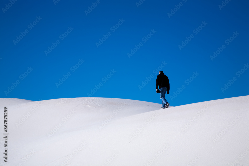 A hiker in the White Sands National Monument.  It is in the northern Chihuahuan Desert in the U.S. state of New Mexico