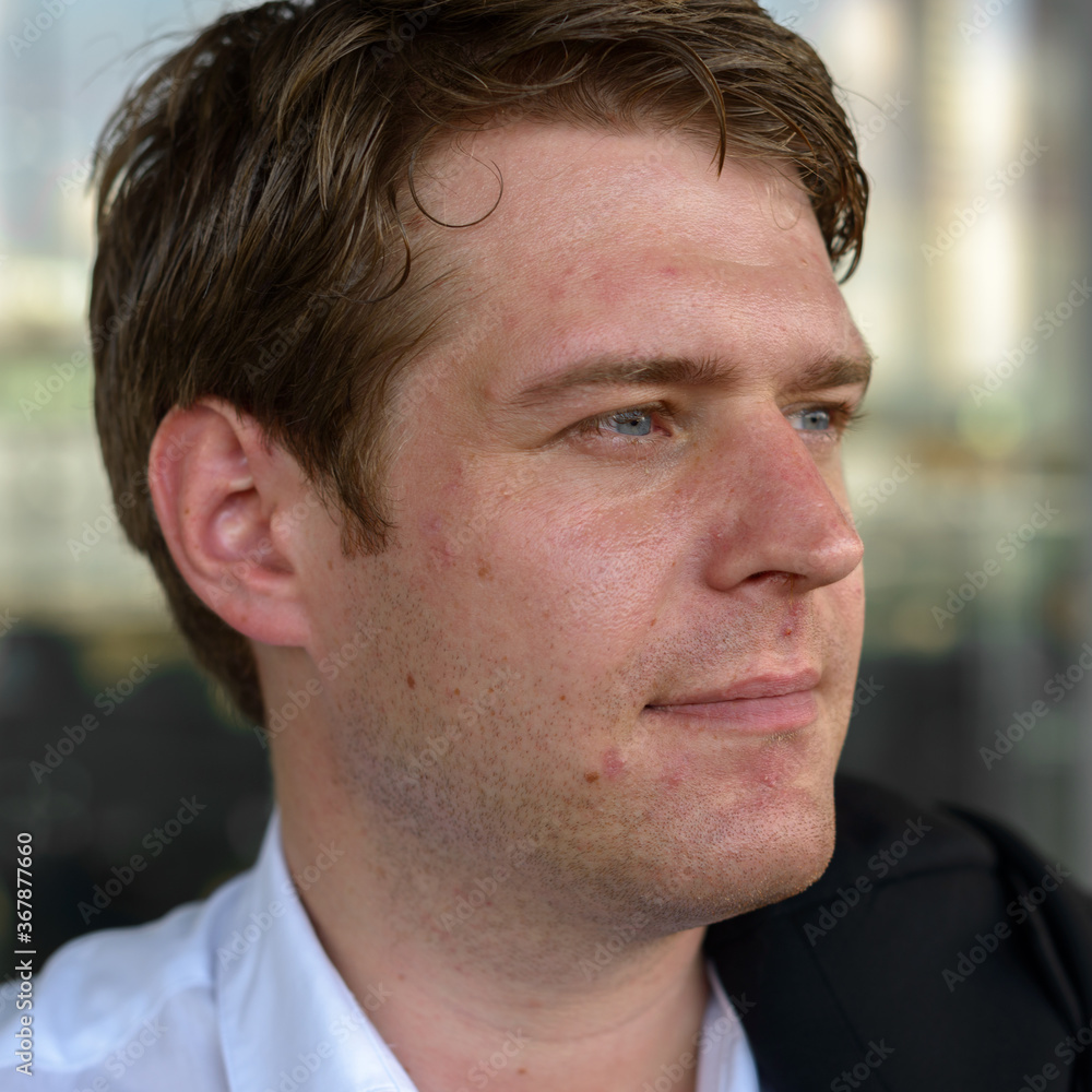 Obraz premium Portrait of young handsome businessman at the airport