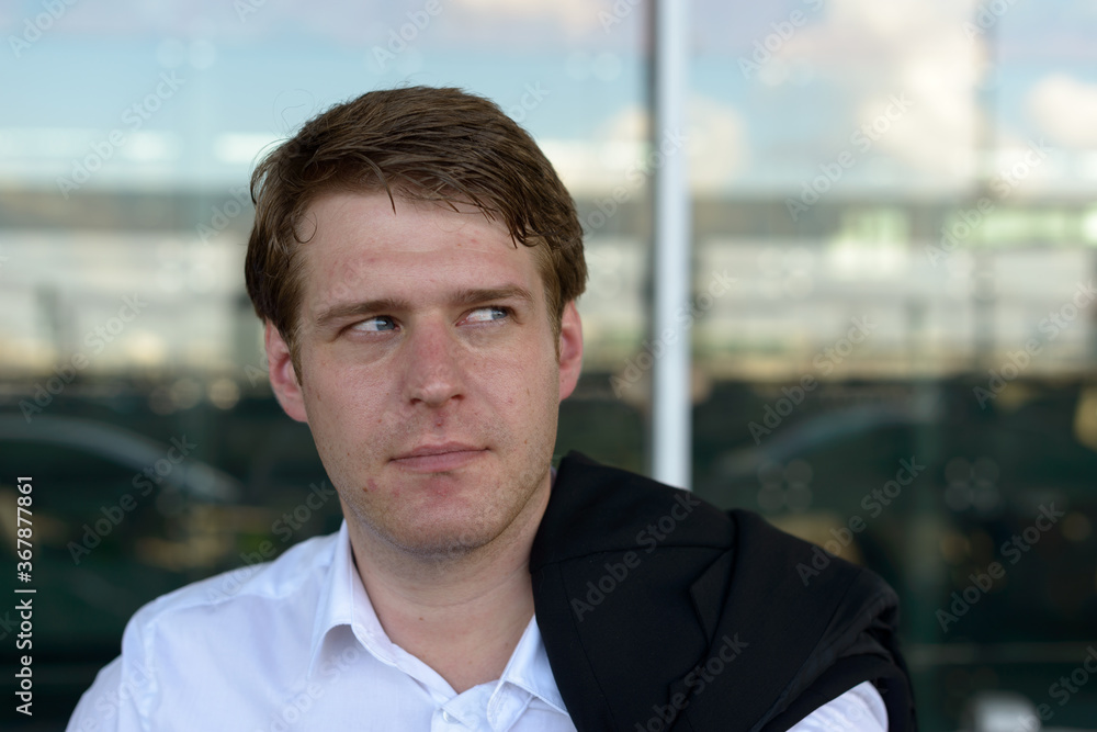 Portrait of young handsome businessman at the airport Portrait of young handsome businessman at the airport