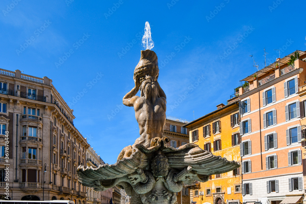 The Triton Fountain in the Piazza Barberini, Rome Italy, representing Triton, half-man and half-fish, blowing his horn to calm the waters