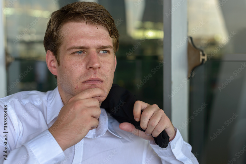 Portrait of young handsome businessman at the airport Portrait of young handsome businessman at the airport
