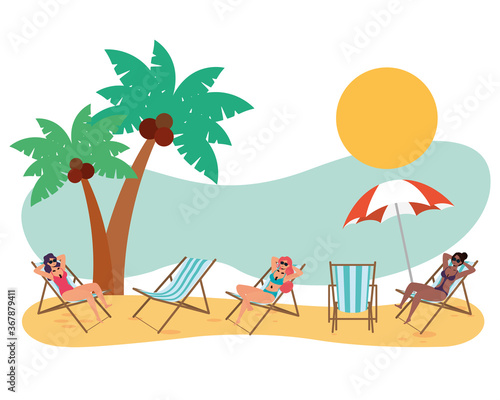 interracial women on the beach practicing social distance