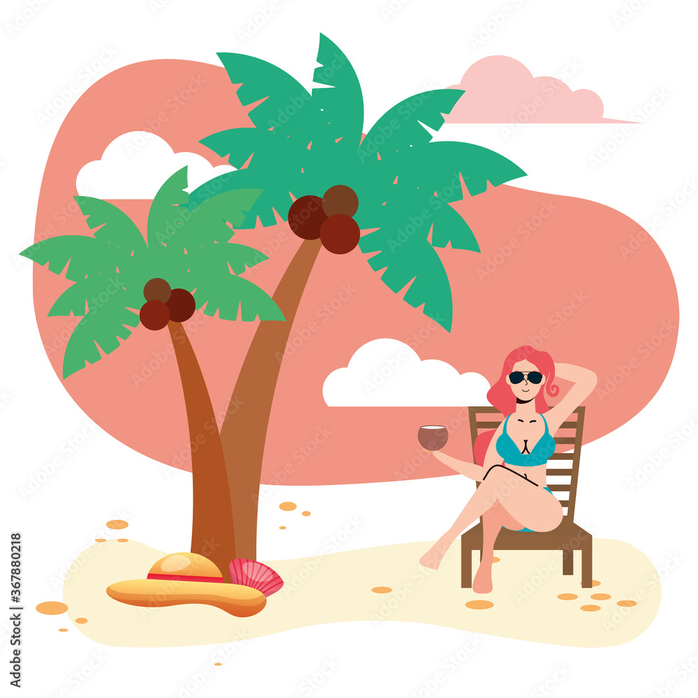 beautiful woman wearing swimsuit seated in beach chair eating coconut