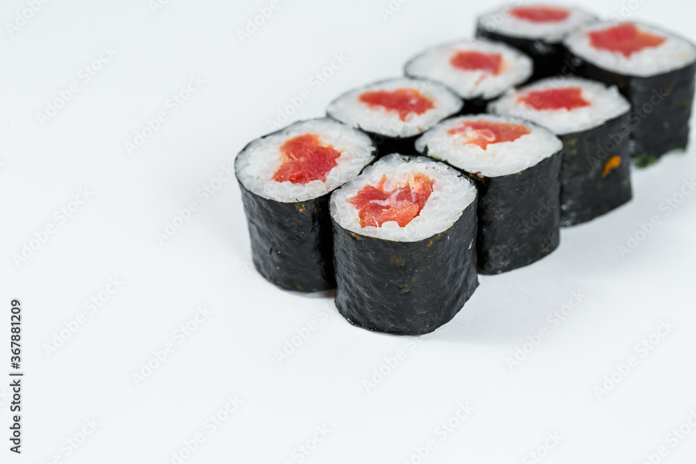 Japanese food. Rolls with red fish, fresh rice with eel, wrapped in nori. Japanese food. Rolls with red fish, fresh rice with eel, wrapped in nori.