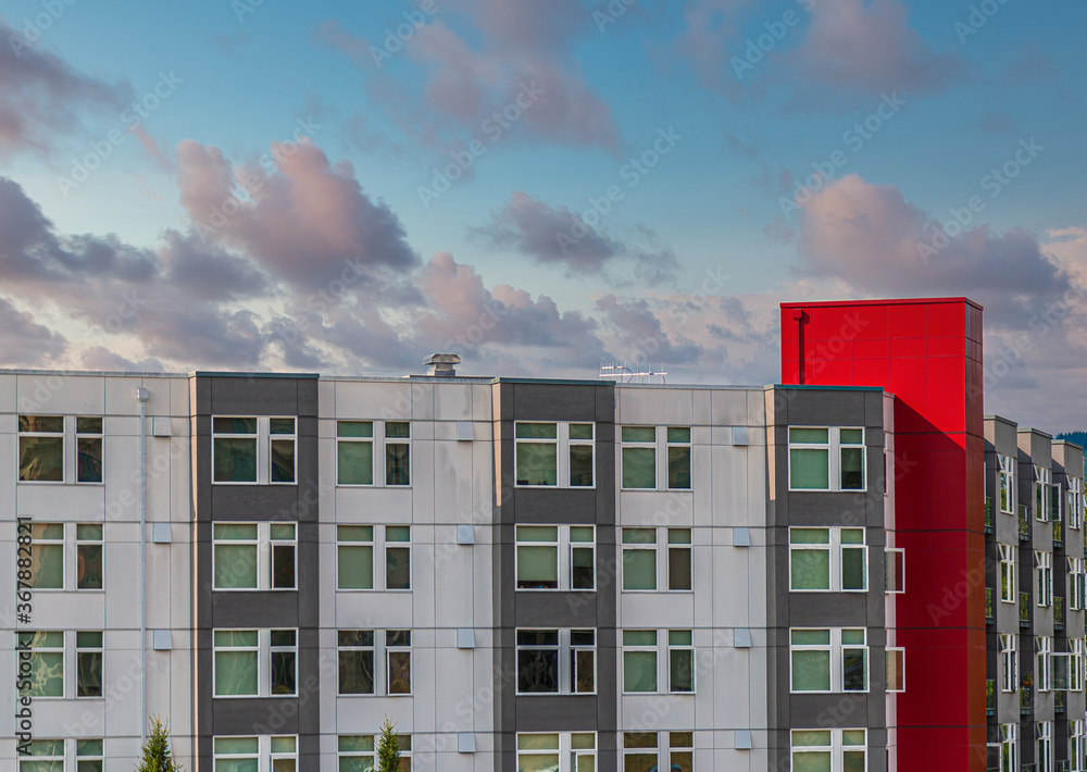 Modern Condo Buildings of Silver and Grey with Red Trim