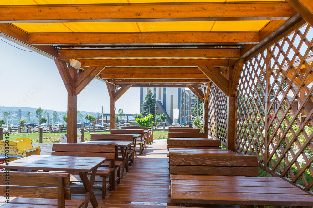 Wooden summer garden restaurant in the beautiful nature