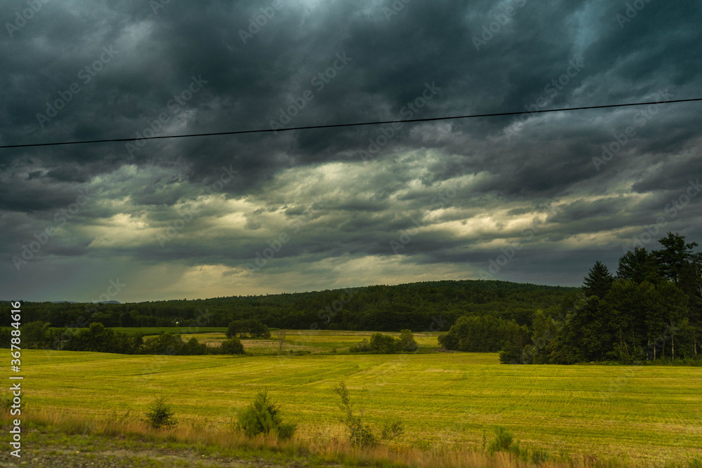 storm clouds over the field storm clouds over the field
