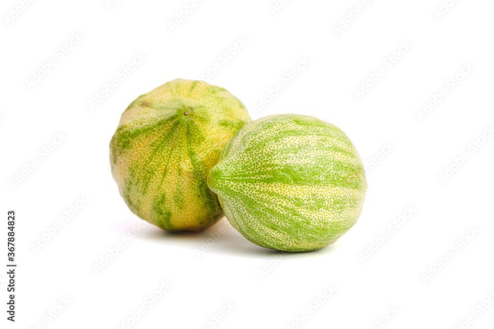 Variegated pink lemons or pink-fleshed Eureka lemons isolated on white background. Citrus fruits with striped rind