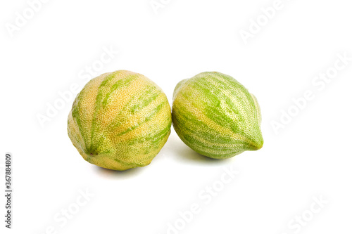 Variegated pink lemons or pink-fleshed Eureka lemons isolated on white background. Citrus fruits with striped rind