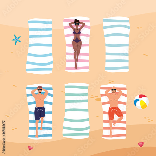 interracial people on the beach practicing social distance