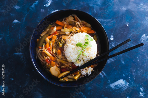 plant-based food, vegan sticky rice with stir fry vegetables in sweet and sour sauce