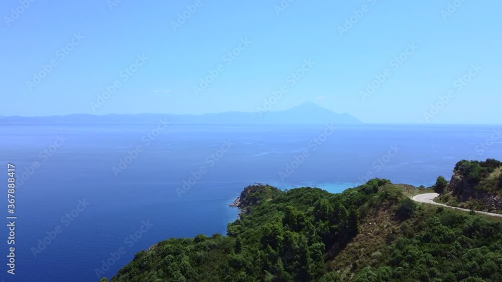 Aerial view of traffic road on the hill and blue sea. Travel vacation concept Aerial view of traffic road on the hill and blue sea. Travel vacation concept